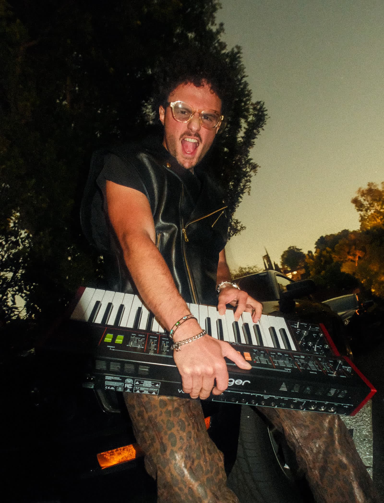 LinoXren on keytar, leather jacket, leopard print